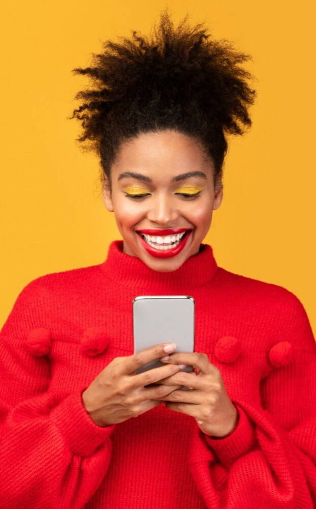Smiling woman looking at a recruitment website on a mobile device
